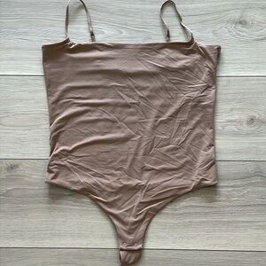 DELTA BOGART LINGERIE LTD. Thong Bodysuit - tan